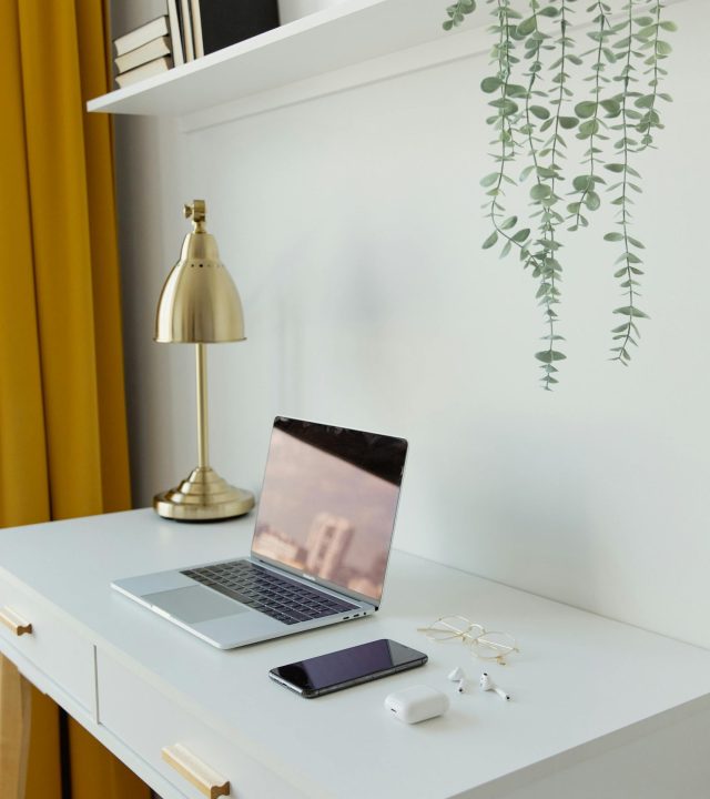 Stylish home office desk with modern technology ideal for productivity.